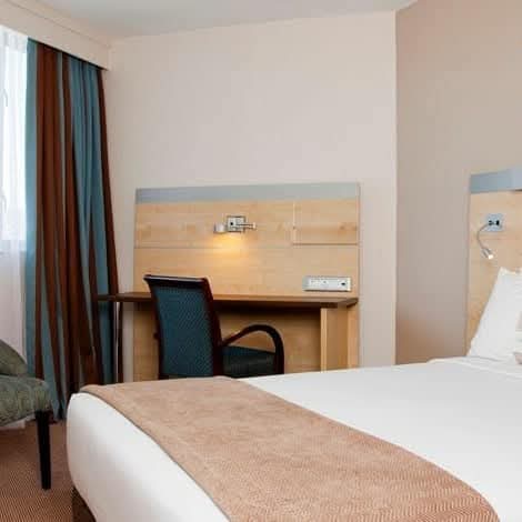Safari lodge exterior with thatched roof accommodation